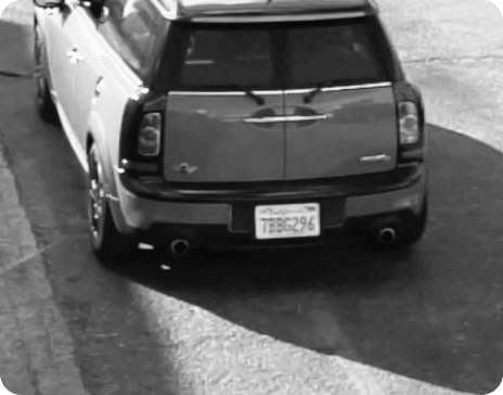back of a parked truck including license plate as seen from a drone camera